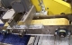 Vacuum assisted transfer conveyor